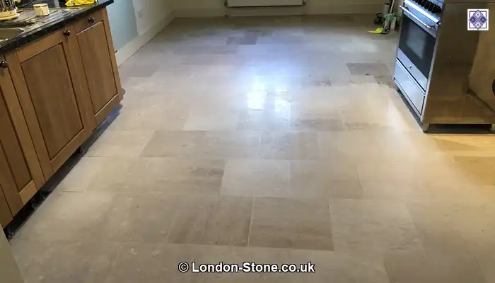 Applying impregnating sealer to limestone to reduce absorption and help protect against everyday staining.