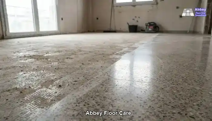 Grinding and Polishing Terrazzo: Aged terrazzo floor in a period Edinburgh room with a muted, timeworn surface.