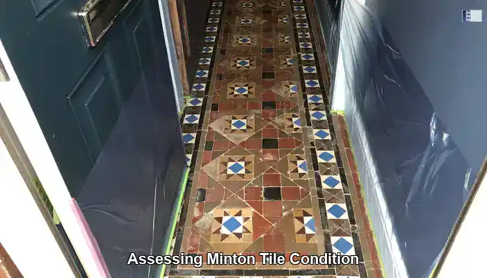 Close inspection of Minton Victorian tiles showing wear, staining and grout condition
