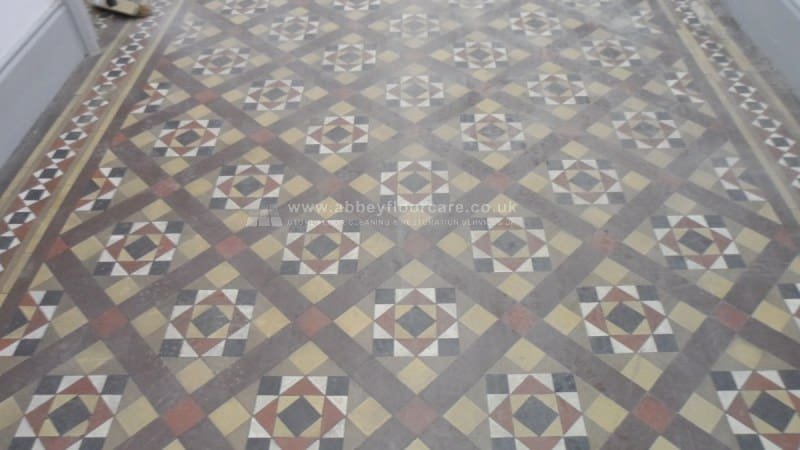 Dull patchy Victorian clay tile hallway in Windsor before cleaning