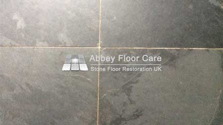Dirty slate floor tiles in Matlock with dull finish and ingrained soil
