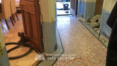 Terrazzo floor being polished to restore a smooth, glossy surface