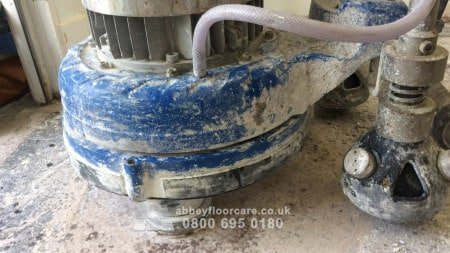 Terrazzo floor with worn patches and scratches before UK restoration work