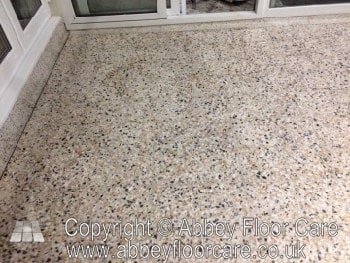 Honed terrazzo floor with clean edges beside skirting boards