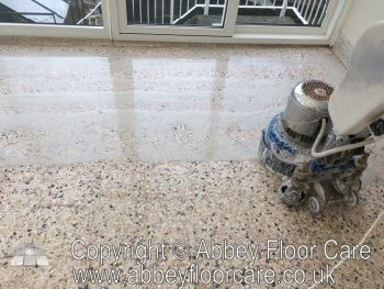 Professional grinding a terrazzo floor during restoration in Kinver